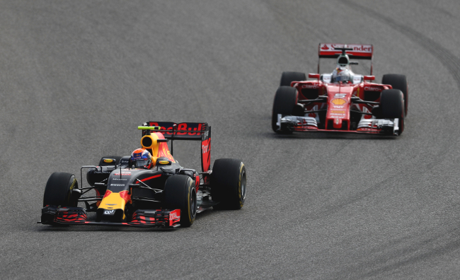 AUSTIN, TX - OCTOBER 23:  Max Verstappen of the Netherlands driving the (33) Red Bull Racing Red Bull-TAG Heuer RB12 TAG Heuer leads Sebastian Vettel of Germany driving the (5) Scuderia Ferrari SF16-H Ferrari 059/5 turbo (Shell GP) on track during the United States Formula One Grand Prix at Circuit of The Americas on October 23, 2016 in Austin, United States.  (Photo by Lars Baron/Getty Images)